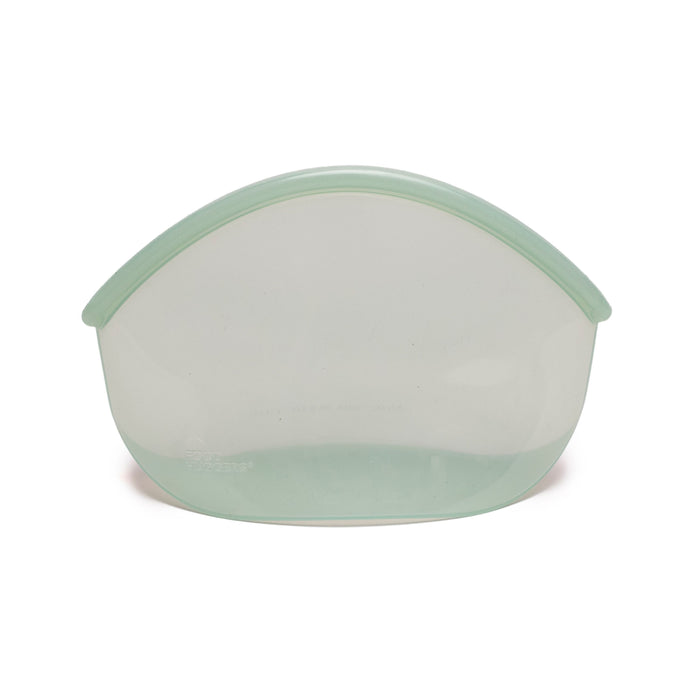 A translucent, light green silicone storage bag with a curved top and flat base, standing upright on a white background.