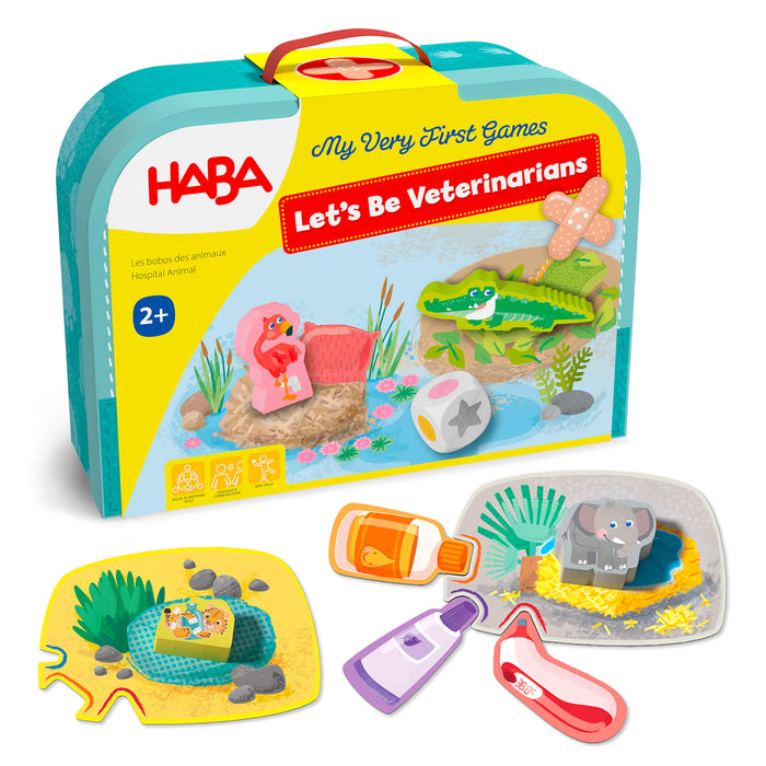 HABA My Very First Games - Let’s Be Veterinarians set featuring a carrying case, wooden animal figures, a die, and medical toy accessories including bottles and a thermometer for an educational board game.