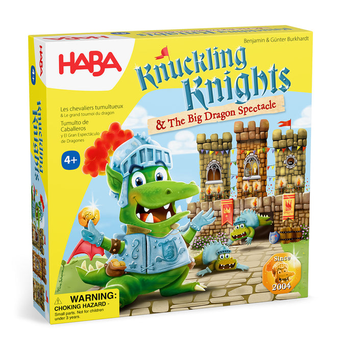 Front of the HABA Knuckling Knights 3D Board Game - Dragon Spectacle, for ages 4+, shows a smiling green dragon in knight armor before a castle. The playful yellow box features fun illustrations and a clear warning label.