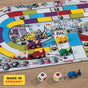 The HABA Monza Educational Race Car Board Game for ages 5+ features colorful wooden cars in red, blue, yellow, green, and purple, three dice with colored dots, a racetrack theme, and is proudly made in Germany—perfect for young racing fans.