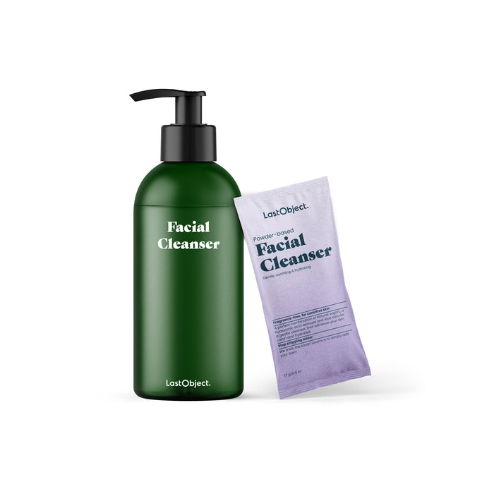 A green pump bottle labeled Facial Cleanser stands next to a lavender packet labeled Powder-based Facial Cleanser, both from the brand LastObject, against a white background.