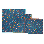 Bees Wrap Reusable Gift Wrap features organic cotton with a dark blue background and colorful woodland animal and nature designs by Vermont artists, arranged overlapping one another.