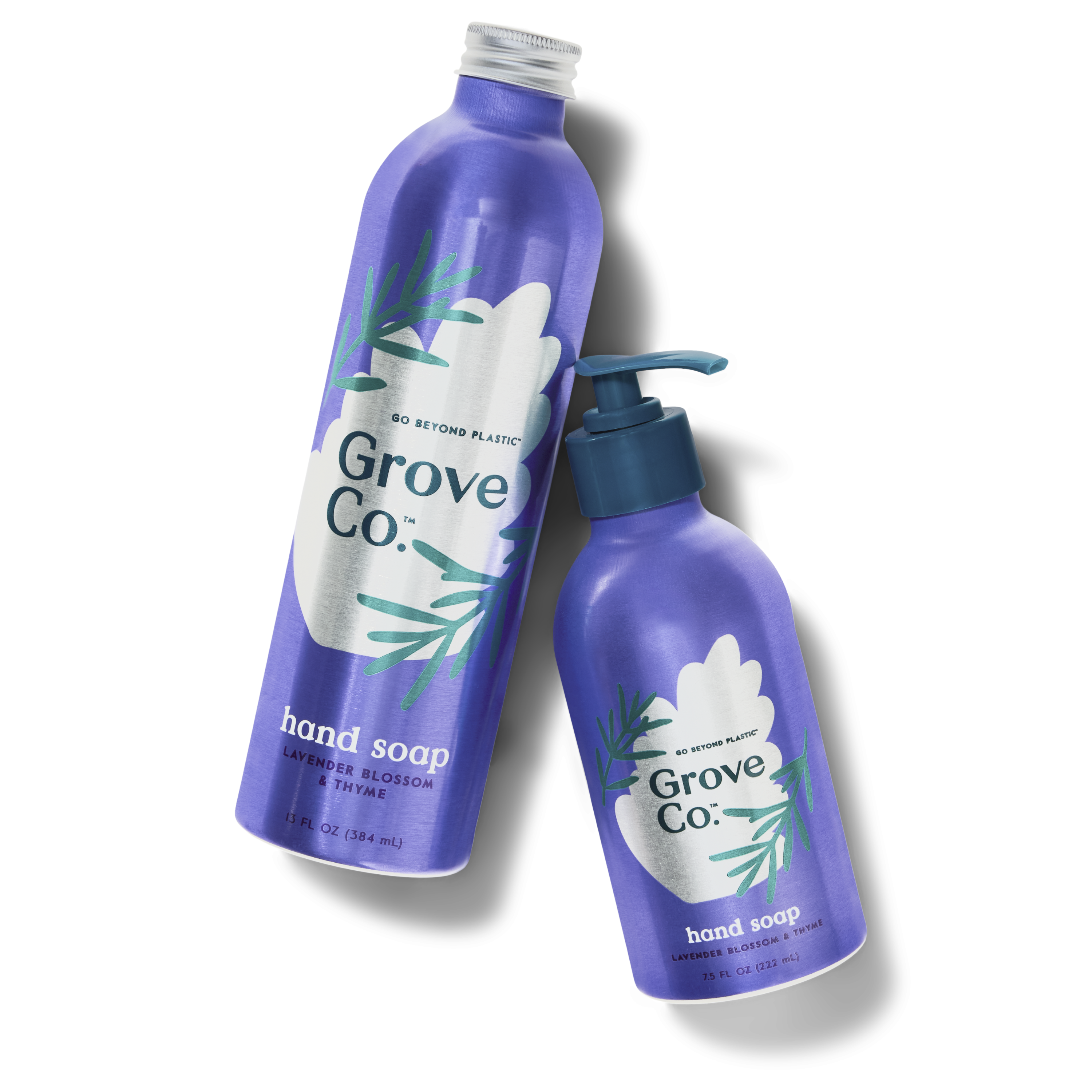 Two Grove Co. hand soap bottles, one refill and one hand soap with a pump. Bottle bottles are aluminum and are lavender blossom & thyme scented.