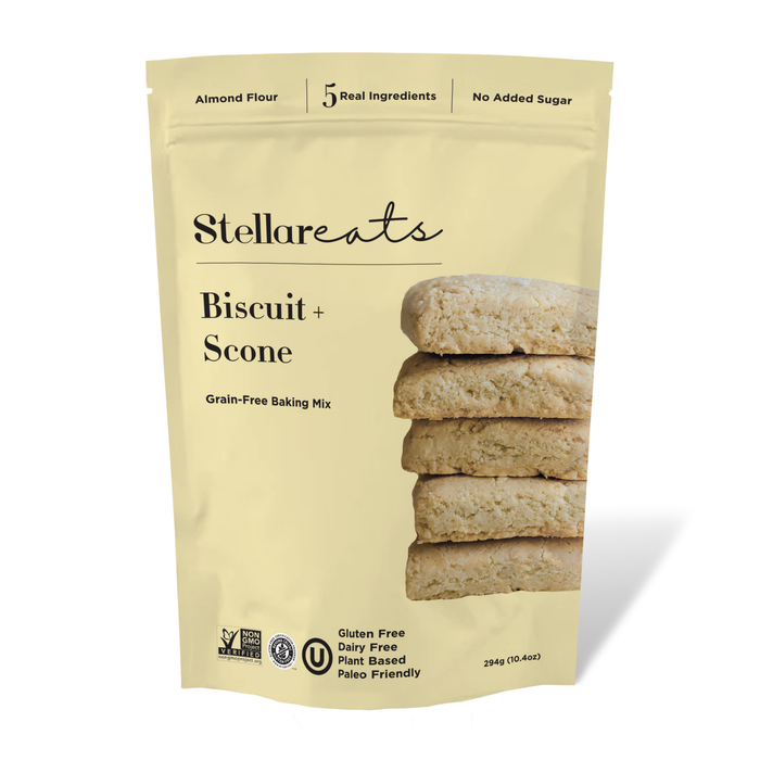 A beige package of Stellareats Biscuit + Scone Grain-Free Baking Mix, featuring a stack of four biscuits. The packaging highlights that it is gluten-free, dairy-free, plant-based, and contains no added sugar.