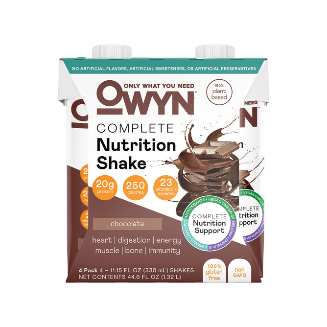 The front of a 4-pack OWYN Complete Nutrition Shake in chocolate flavor displays 20g plant protein, 23 vitamins & minerals, and 250 calories. It supports heart, digestion, energy, muscle, bone health, and immunity. The shake is vegan and gluten-free.