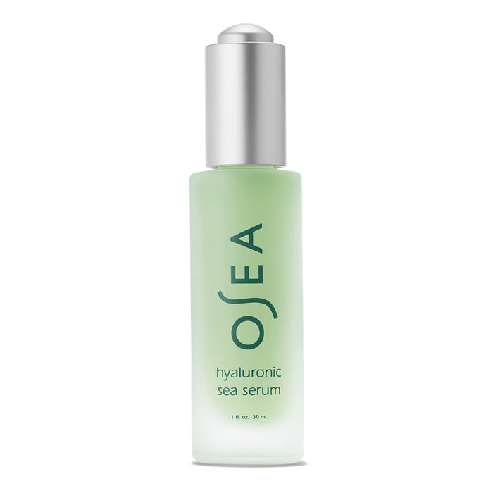 A frosted glass bottle with a silver pump top labeled OSEA hyaluronic sea serum, containing 1 fl oz (30 ml) of product. The liquid inside appears light green.