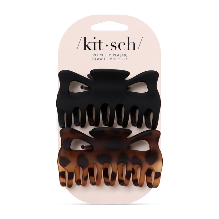 Two large hair claw clips by Kitsch, one solid black and one brown tortoiseshell pattern, displayed on a branded card backing that reads Recycled Plastic Claw Clip 2pc Set.