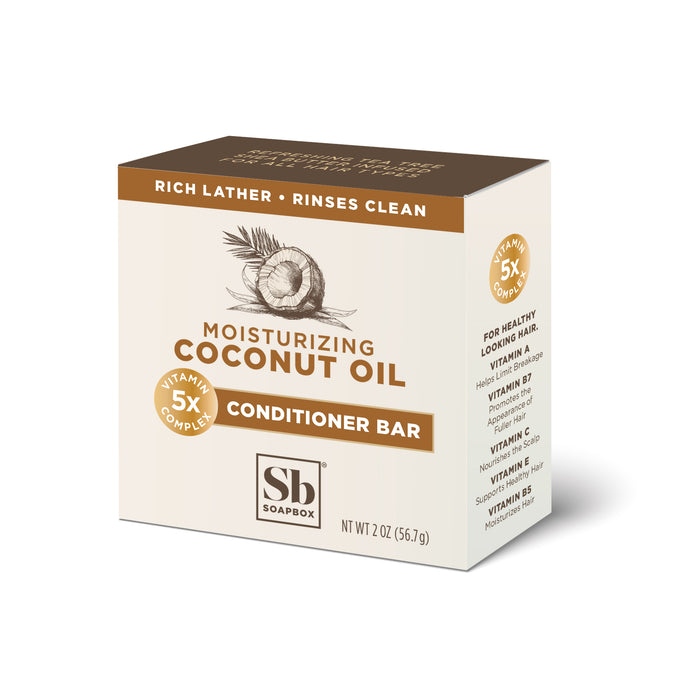 A box of Soapbox Moisturizing Coconut Oil Conditioner Bar with a coconut and leaf graphic. The packaging highlights rich lather, rinses clean, 5x vitamin complex, and is 2 oz (56.7g) in size.