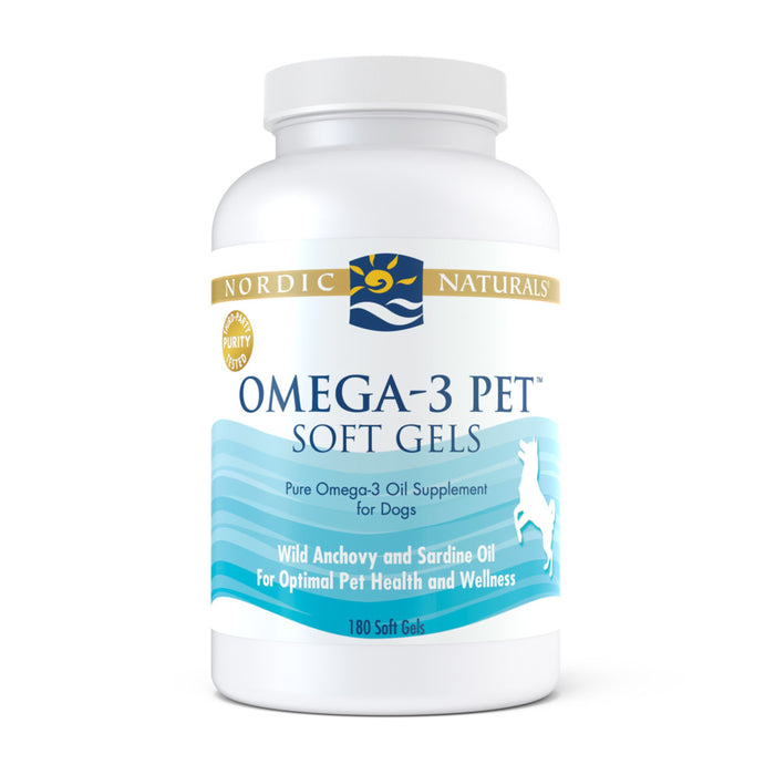 A white bottle labeled Nordic Naturals Omega-3 Pet Soft Gels, containing 180 soft gels for dogs, with blue waves and a dog silhouette, promoting wild anchovy and sardine oil for pet health.