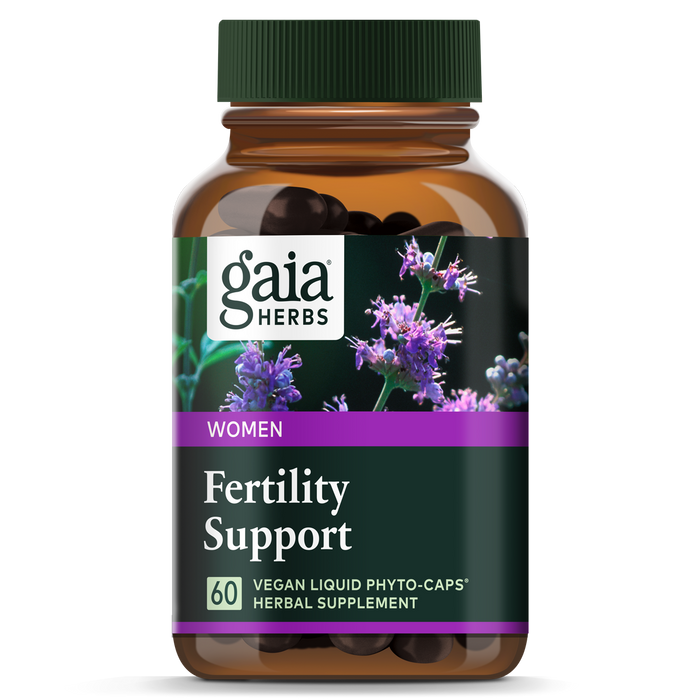 A brown bottle of Gaia Herbs Fertility Support for women, labeled as containing 60 vegan liquid phyto-caps herbal supplements. The label features purple flowers and green accents.