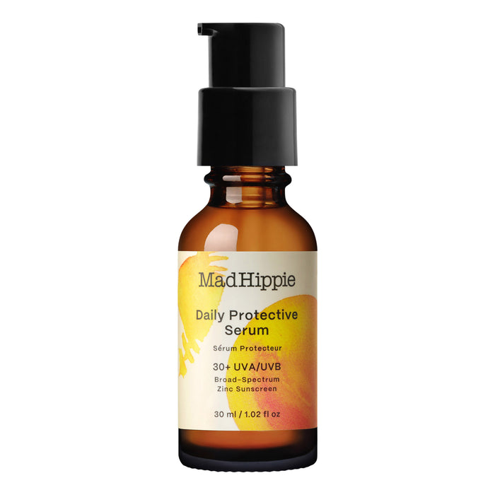 A brown glass pump bottle labeled Mad Hippie Daily Protective Serum with SPF 30+ UVA/UVB broad-spectrum zinc sunscreen, 30 ml size, featuring a yellow and orange design on the label.