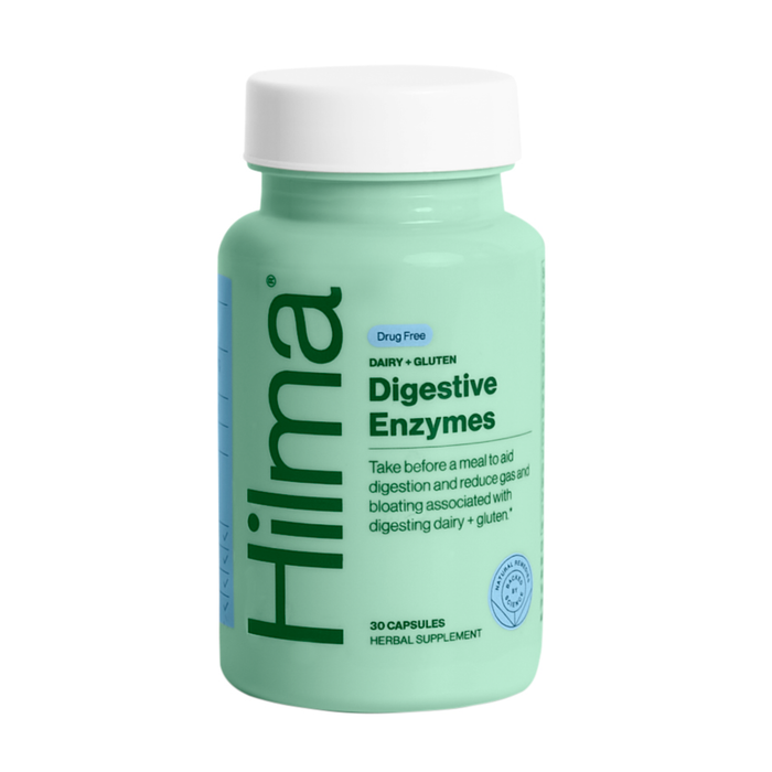 A light green bottle labeled Hilma Digestive Enzymes, with information stating it is drug-free, dairy- and gluten-free, and contains 30 capsules to support digestion and reduce gas and bloating.