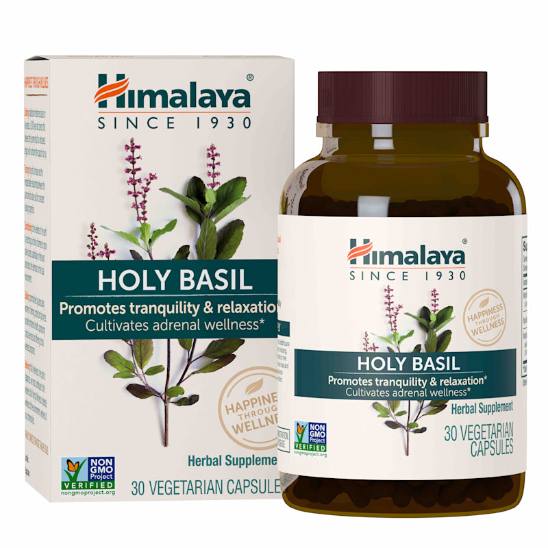 The Himalaya Holy Basil herbal supplement features a basil plant illustration on the bottle and box, emphasizing stress relief, tranquility, and adrenal wellness. This Ayurvedic product contains 30 non-GMO vegetarian capsules for relaxation.