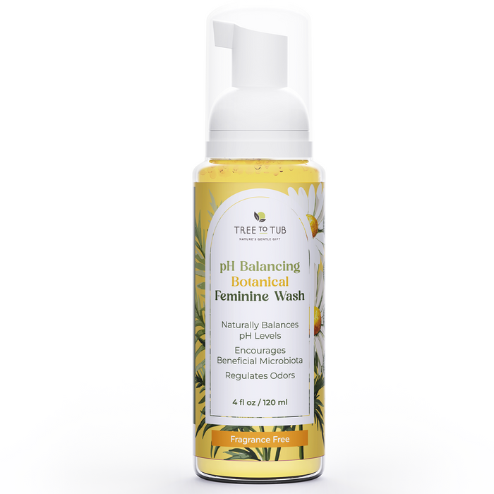 A bottle of Tree to Tub pH Balancing Botanical Feminine Wash with a foaming pump, labeled as fragrance-free. The label features chamomile flowers and highlights benefits like balancing pH, supporting microbiota, and odor regulation.