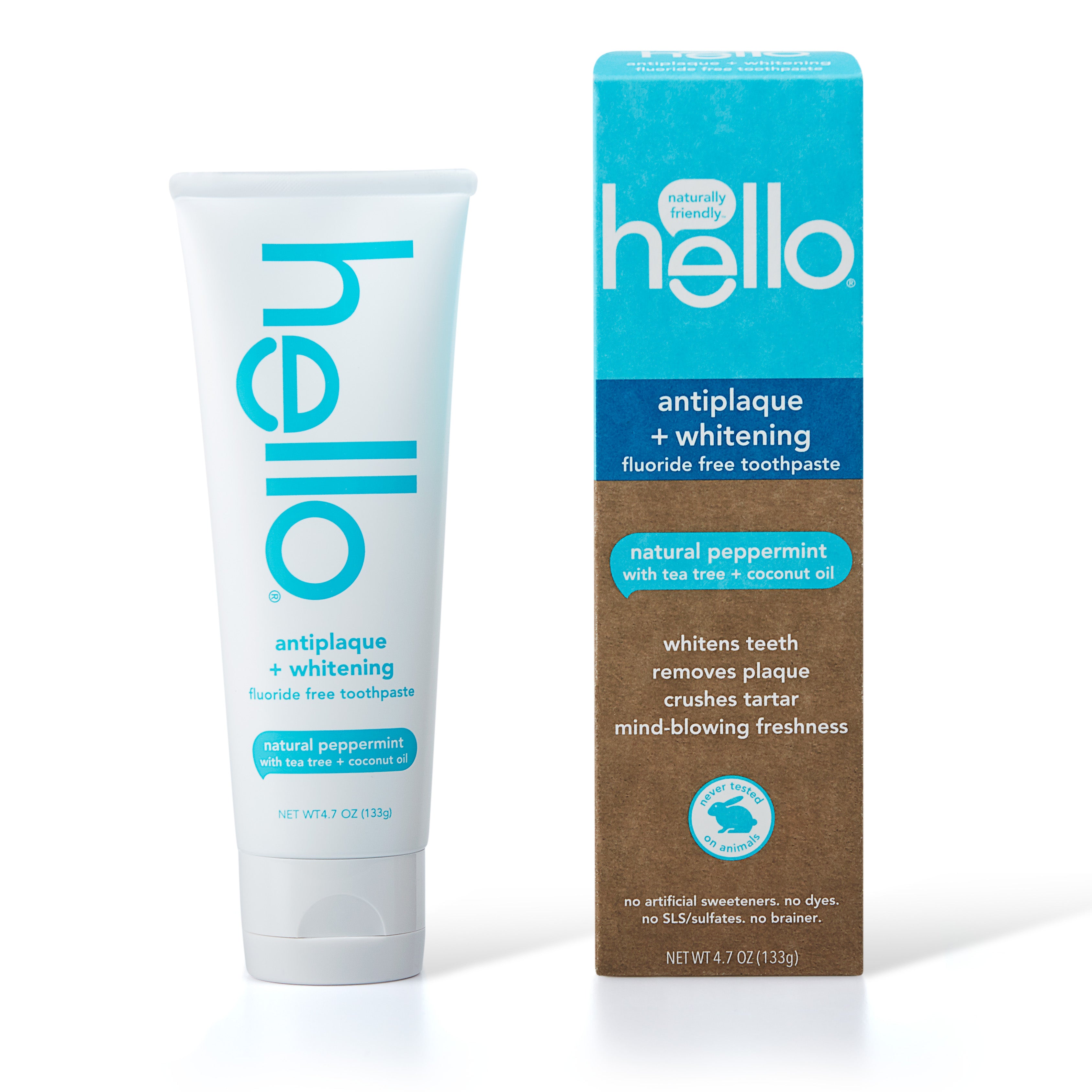 A tube of hello Antiplaque & Whitening Fluoride Free Toothpaste is displayed next to its box, highlighting its natural formula with peppermint flavor, tea tree, and coconut oil. The packaging promotes benefits like plaque removal and tartar control.