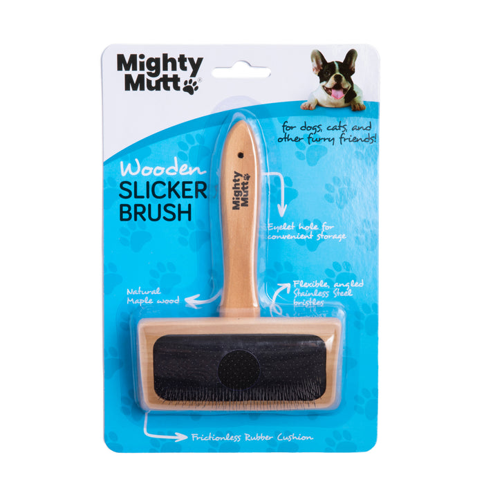 A Mighty Mutt wooden slicker brush in packaging, featuring a wooden handle and rectangular brush head with black bristles. The packaging is white and blue with product details and a cartoon dog image in the top right corner.