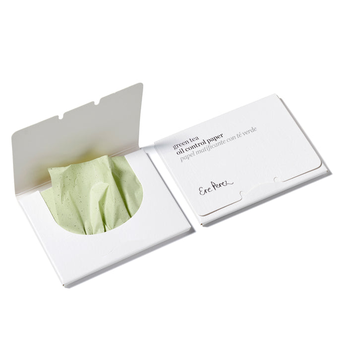 Two white packets of green tea oil control paper, one open showing light green blotting paper inside, and the other closed with product information and the brand name Ere Perez printed on the front.