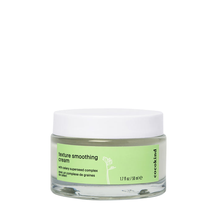 A glass jar of Cocokind texture smoothing cream with a white lid and a green label, containing 1.7 fl oz (50 ml). The label features text and a small celery graphic.