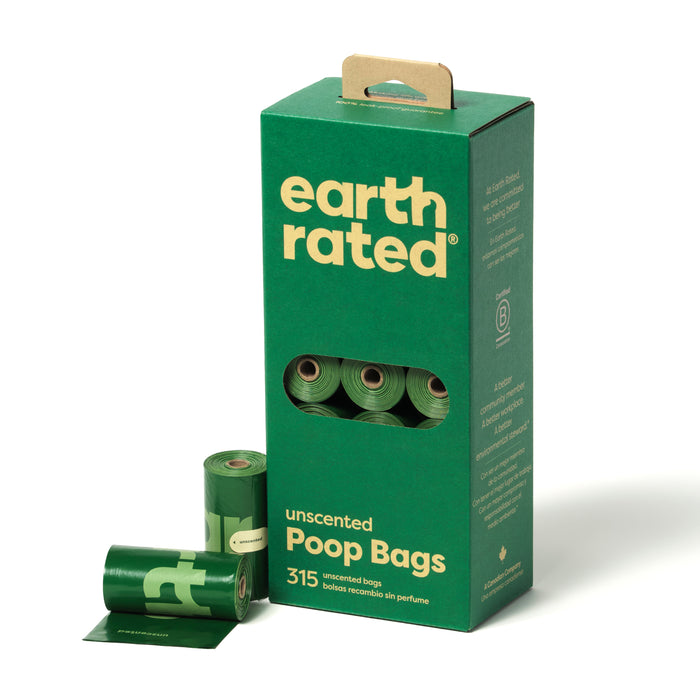 A box of Earth Rated unscented poop bags with three green rolls of bags partially pulled out. The box is green with yellow and white text, indicating there are 315 unscented bags inside.