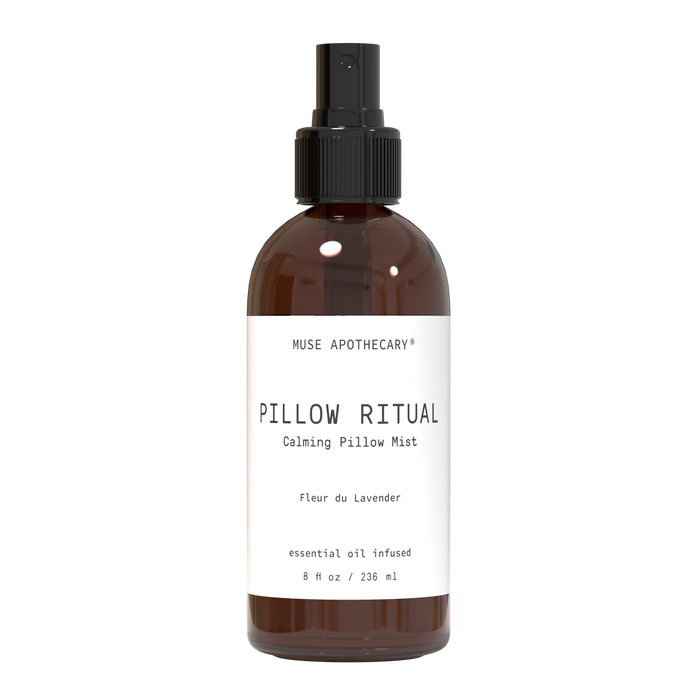 A brown spray bottle labeled Pillow Ritual Calming Pillow Mist by Muse Apothecary, featuring the scent Fleur du Lavender, essential oil infused, with a capacity of 8 fl oz (236 ml).