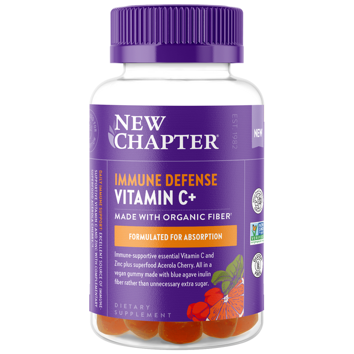 A bottle of New Chapter Immune Defense Vitamin C+ gummies with a purple lid and label, featuring orange gummies inside and illustrations of cherries and leaves. The label highlights organic fiber and immune support.
