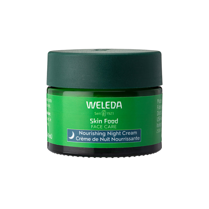 A green jar of Weleda Skin Food Face Care Nourishing Night Cream with a dark green lid, featuring white and blue text on the label, shown against a white background.