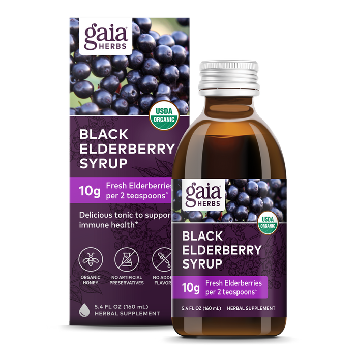 A bottle and box of Gaia Herbs Black Elderberry Syrup, featuring images of elderberries, “USDA Organic” label, and text highlighting 10g fresh elderberries per 2 teaspoons. Package is purple with white text.