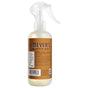 A spray bottle of Mrs. Meyer’s Room Freshener, featuring a clear trigger spray top and brown label, contains essential oils and freshens rooms with a non-aerosol formula.