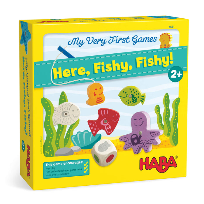 A yellow box for the game My Very First Games: Here, Fishy, Fishy! showing colorful fish, an octopus, seaweed, and a fishing pole. The game is for ages 2 and up and encourages play and learning.