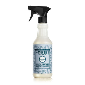 Mrs. Meyers Multi-Surface Cleaner in Snowdrop scent comes with a black nozzle and a blue label highlighted by garden-inspired floral illustrations, infused with essential oils for everyday cleaning.