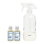 A clear MULTI spray bottle is next to two Grove Co. Multi-Purpose Cleaner Starter Set concentrate bottles, featuring sustainable packaging with blue labels and twist-off caps, containing a powerful plant-based formula.