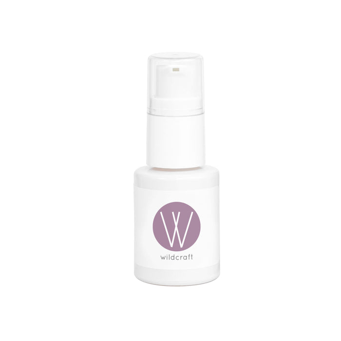 A small white pump bottle labeled with a purple circle featuring a large W and the word wildcraft underneath, set against a plain white background.
