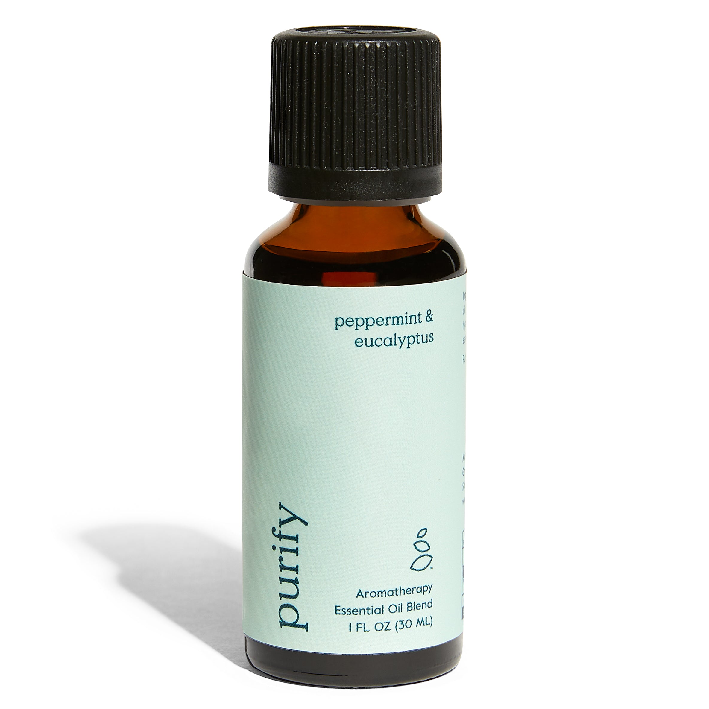 A 1 fl oz (30 mL) amber bottle with a black cap labeled Purify Essential Oil Blend - Peppermint & Eucalyptus by Grove Co. features a light green label and offers a refreshing aromatherapy home fragrance.