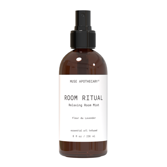 A brown spray bottle labeled MUSE APOTHECARY ROOM RITUAL Relaxing Room Mist with Fleur du Lavender and essential oil infused written below, containing 8 fl oz (236 ml) of product.