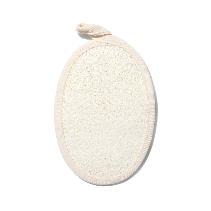 An oval-shaped natural loofah sponge pad with a fabric border and a small loop for hanging, shown on a white background.