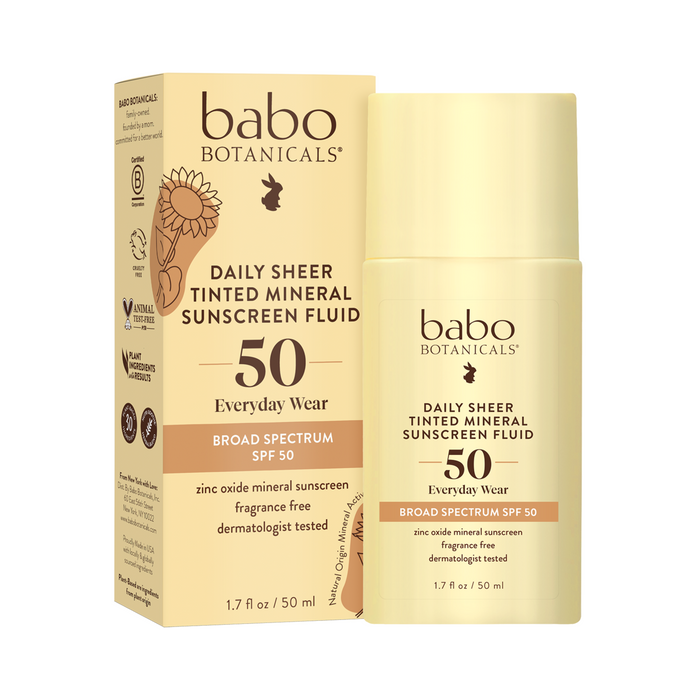 Babo Botanicals Daily Sheer Tinted Mineral Sunscreen Fluid SPF 50, 1.7 fl oz bottle shown next to its packaging. The packaging highlights broad spectrum SPF 50, fragrance-free, and dermatologist tested.