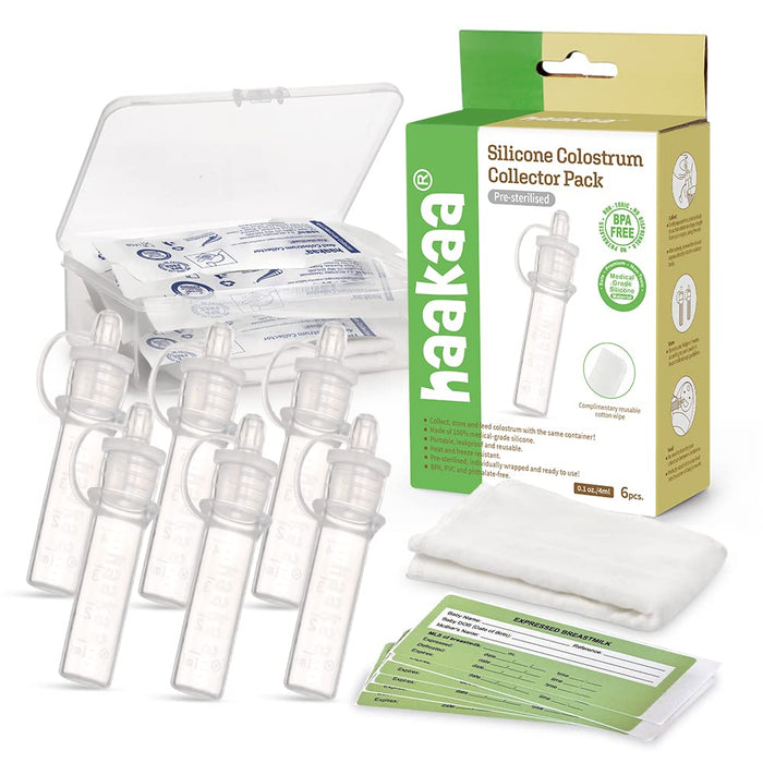 Haakaa Silicone Colostrum Collector Pack with six clear tubes, a storage case, individually wrapped items, a yellow box, cloth, and green information cards, displayed on a white background.