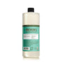 A bottle of Mrs. Meyer’s Clean Day liquid cleaner with a black cap, featuring a teal label detailing product information and ingredients. The bottle is standing upright on a white background.