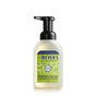 A bottle of Mrs. Meyer’s Clean Day Foaming Hand Soap with a black pump, featuring a green and yellow label that reads “Lemon Verbena” and highlights essential oils and aloe vera. The bottle contains 10 fl oz (296 mL).