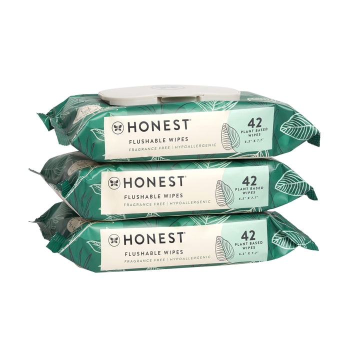 Three stacked packs of Honest brand flushable wipes, each containing 42 fragrance-free, plant-based, hypoallergenic wipes in green and white packaging with leaf designs.