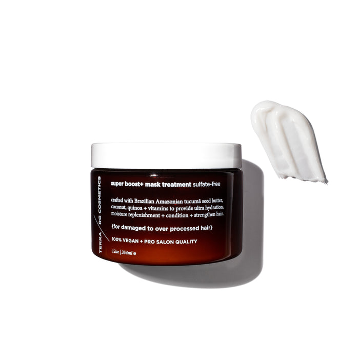 A brown jar labeled super boost+ mask treatment sulfate-free sits on a white surface with a creamy white hair mask sample smeared beside it. The jar is 12 oz (354 ml) and promotes vegan, salon-quality hair care.