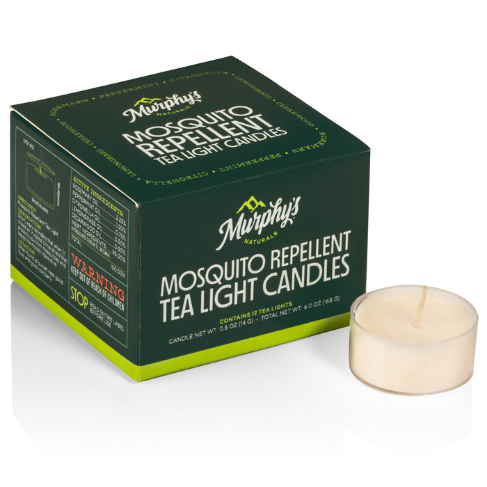 A box labeled Murphy’s Mosquito Repellent Tea Light Candles sits next to an unlit white tea light candle on a white background. The box is green with white and yellow text.