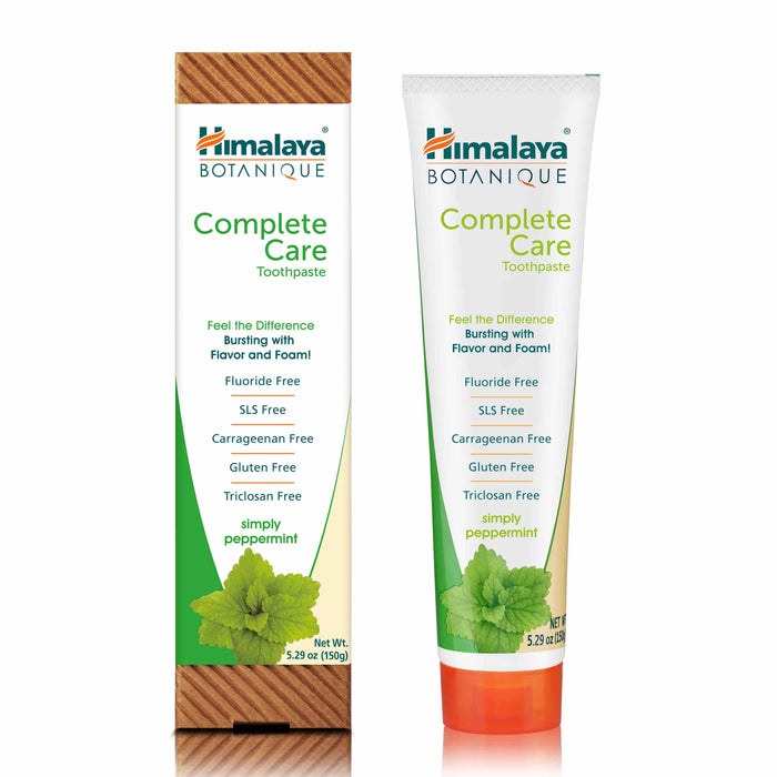 A box and tube of Himalaya Botanique Complete Care Toothpaste, labeled as fluoride free, SLS free, carrageenan free, gluten free, triclosan free, and peppermint flavor, with mint leaves pictured on the packaging.