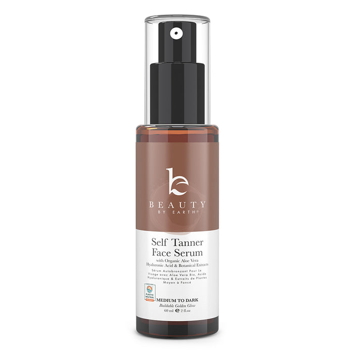 A brown bottle of Beauty by Earth Self Tanner Face Serum with a black pump, featuring a white label and text indicating it is for medium to dark skin tones.