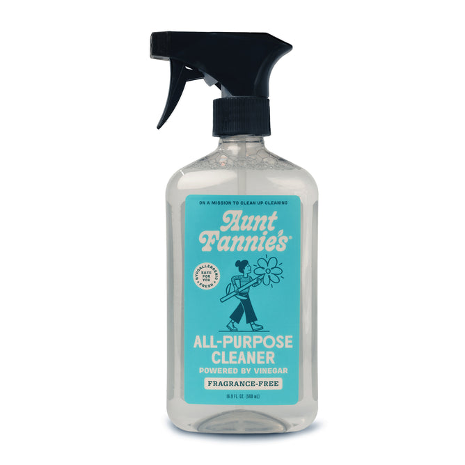 A spray bottle of Aunt Fannies All-Purpose Cleaner with a blue label showing a person holding flowers, featuring Vinegar Powered and Fragrance-Free, topped with a black trigger nozzle.