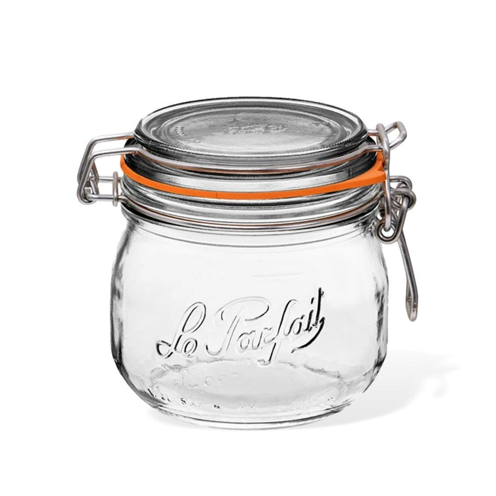A clear glass jar with a round shape, metal clasp closure, and orange rubber seal; Le Parfait is embossed on the front of the jar.