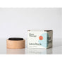A Plant Therapy Lava Rock Passive Diffuser rests beside its box on a white surface with a light background. This passive diffuser features a wooden base with a dark lava rock, ideal for gently dispersing your favorite essential oils in any space.