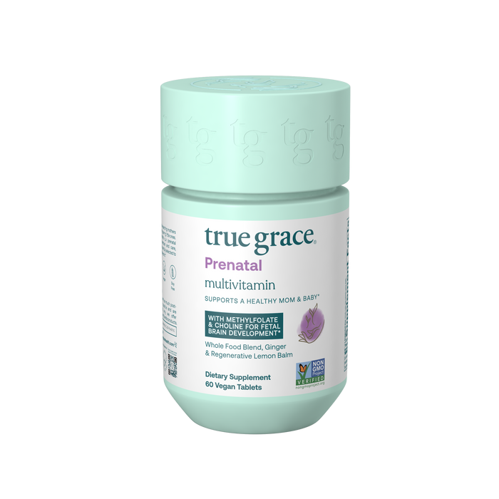 A jar of True Grace Prenatal Multivitamin features a teal cap and label highlighting support for mom and baby with methyl folate, DHA/EPA, and Choline. It holds 60 vegan tablets, is Non-GMO Project Verified, includes Vitamin D3, and promotes healthy brain development.