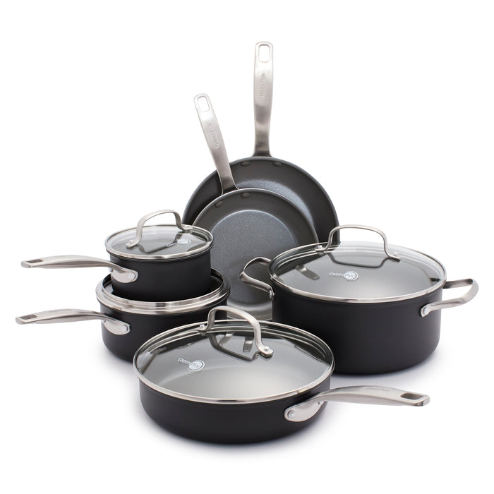 A set of nonstick black cookware with metal handles, including two frying pans, two saucepans with lids, a sauté pan with lid, and a large pot with lid, all arranged together on a white background.