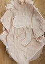 AU Baby Cashmere Cloud Baby Blanket Gift Set in Butter Cream, a pale cream organic cashmere blanket with a heart-patterned knit, featuring a matching bonnet and a single sock placed on top.